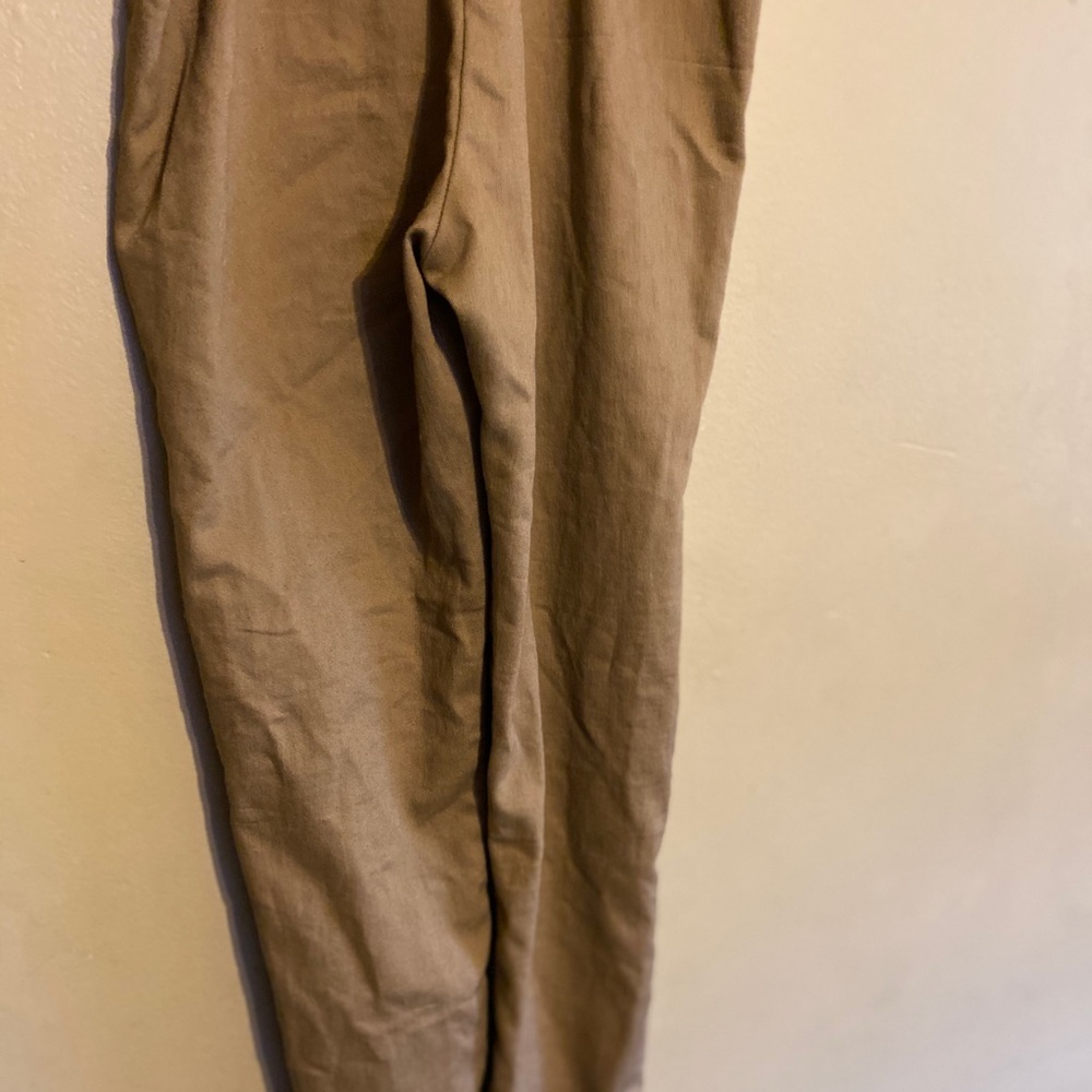 Tan pants zip up on the side